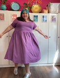 Joanna, a fat babe, wears a purple dress